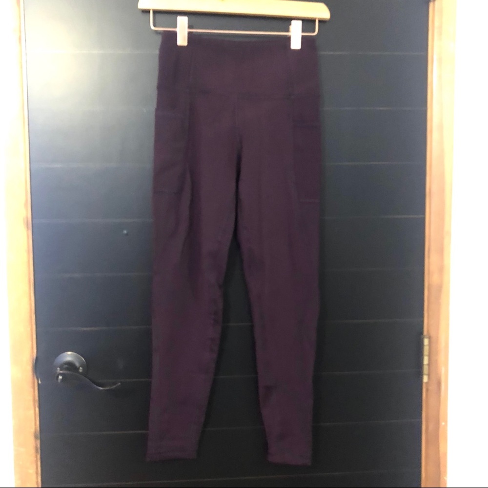 [x by gottex] burgundy leggings.